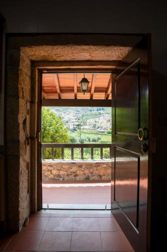 an open door to a room with a window at Fonte dos Pepes by LovelyStay in Lamego
