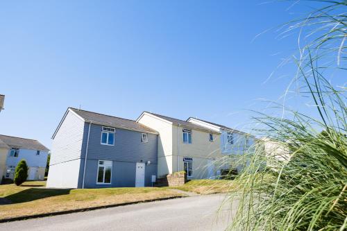 a row of houses on the side of a road at Atlantic Reach Resort in Newquay