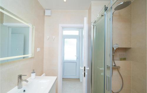 a bathroom with a shower and a sink and a shower at Beautiful Apartment In Dubrovnik With Jacuzzi in Dubrovnik