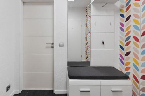 a locker room with a bench and a door at Ferienwohnung Sally in Lenzkirch