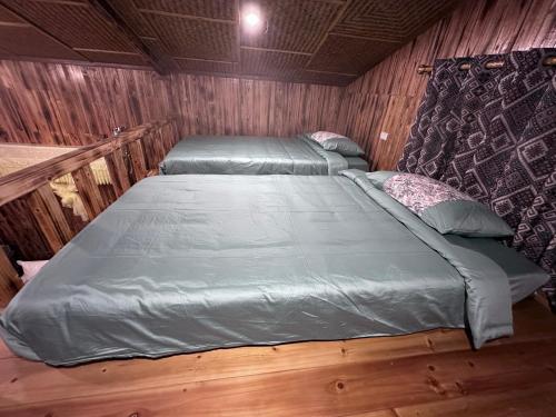 Ένα ή περισσότερα κρεβάτια σε δωμάτιο στο Bac Ha Charm Stay