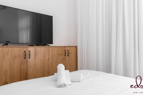 Voodi või voodid majutusasutuse דירה משפחתית בסי סייד עם בריכה מחוממת - By Edom toas