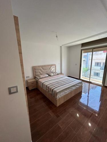 Postel nebo postele na pokoji v ubytování O' appartement Alhoceima