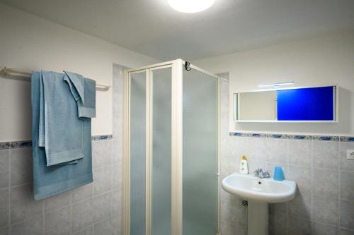 a bathroom with a shower and a sink at Casa stella in San Lorenzo al Mare