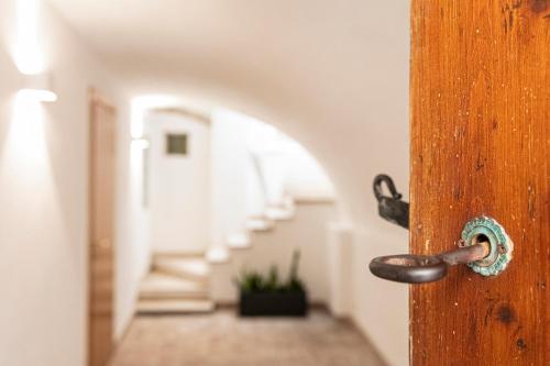 an open wooden door with a hallway in the background at IamartinoApartments in Termoli