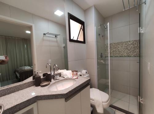 a bathroom with a sink and a shower at VG Sun Cumbuco Sea Breeze Vista Mar in Cumbuco