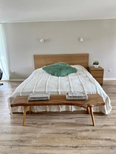 a bed with two pillows on it in a bedroom at ReinuHome in Viljandi