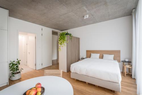Katil atau katil-katil dalam bilik di Carlotta Apartments