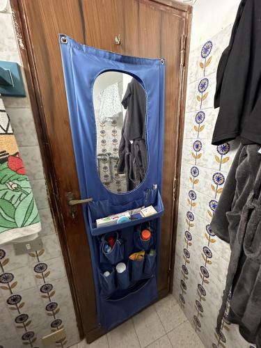 a door with a mirror in a room at Appartamento monolocale Fiuggi 14 MQ piscina dal 20 giugno al 15 settembre in Fiuggi
