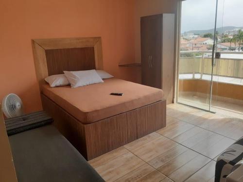 Säng eller sängar i ett rum på Cabo Frio - Jardim Caiçara - Aluguel Econômico