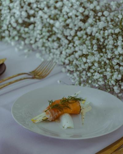 a piece of food on a plate on a table at Merrill House in Picton