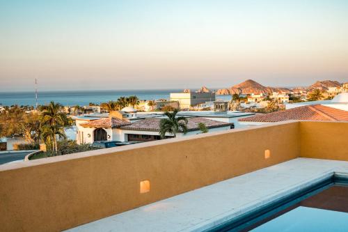 a view of the ocean from the balcony of a resort at Ocean view, pool & gated community in Cabo San Lucas