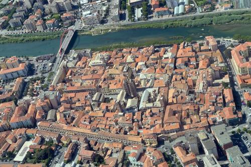 an aerial view of a city and a river at Palazzo Oddo Rental Rooms in Albenga