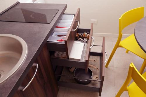 a bathroom with a sink and a counter with a drawer at Casa Bomma in Messina