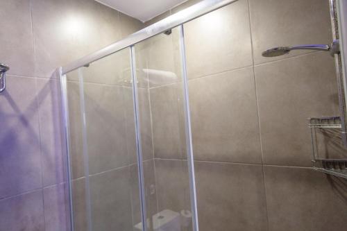 a shower with a glass door in a bathroom at Anthea Hotel Apartments in Ayia Napa