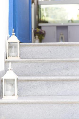 two white lights on the steps of a house at George Studios in Naxos Chora