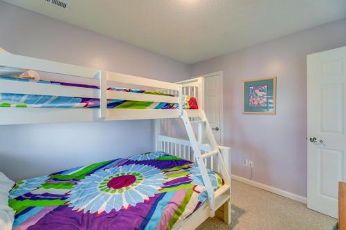 a bedroom with a bunk bed and a ladder at Ocean Front Emerald Isle Vacation Rental Property in Emerald Isle