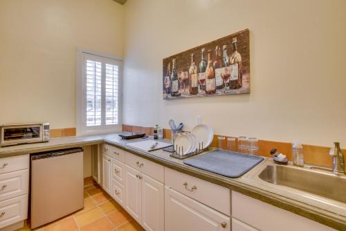 a kitchen with a sink and a counter top at Cozy New Orleans Getaway Near Magazine Street! in New Orleans