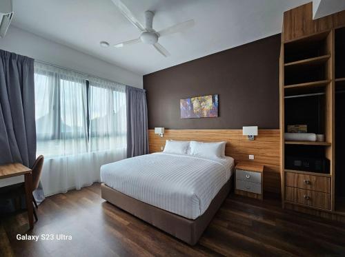 a bedroom with a large bed and a window at Hotspring 1203 Studio Suite @ Sunway Onsen (4pax) in Tambun