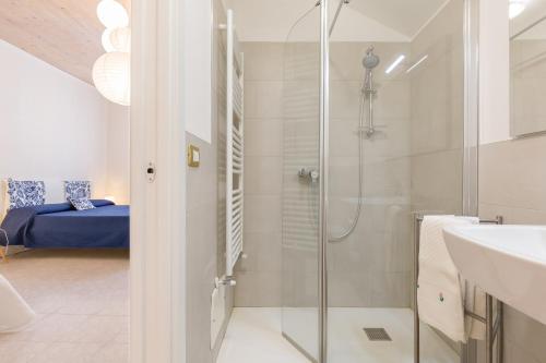 a bathroom with a shower and a sink at B&B King in Verona