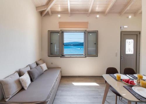 a living room with a couch and a table at Nikolaos Apartment 2 in Nydri