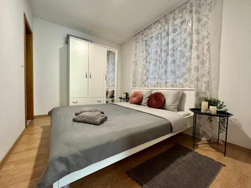 a bedroom with a large bed and a window at Fun house in Zebanec-Selo