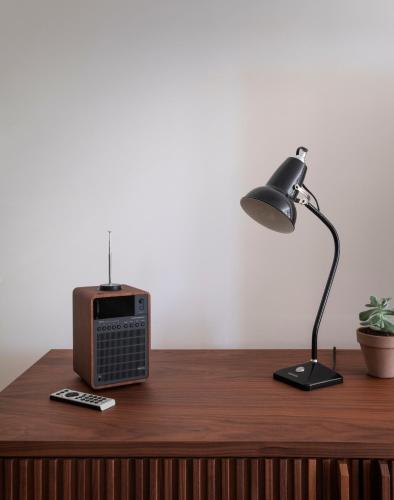 a desk with a lamp and a radio on it at Roost Baltimore in Baltimore