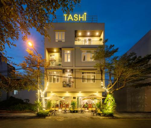 a hotel with a sign that reads testiki at Tashi Park View Hotel & Apartment in Da Nang