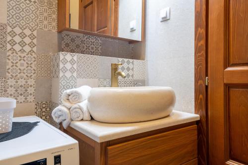 a bathroom with a sink on top of a counter at White Hill Villa in Masline