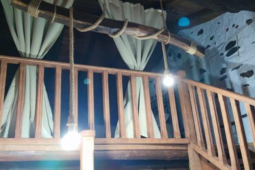 a stage with curtains and lights hanging from the ceiling at Casa rural La calleja de las hurdes TRCC00555 in Sauceda