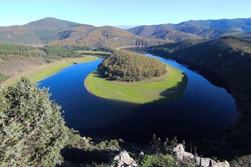 an aerial view of a lake in the mountains at Casa rural La calleja de las hurdes TRCC00555 in Sauceda
