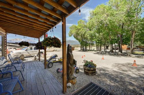 a porch with a statue of a horse on it at Snowy Peaks RV Park in Buena Vista
