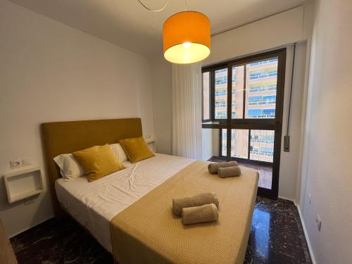 Voodi või voodid majutusasutuse Sur Suites La Marina toas