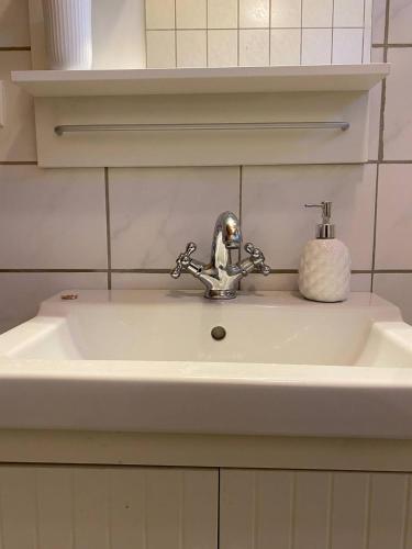 a sink with a faucet in a bathroom at Haus Anastasia in Stolberg i. Harz