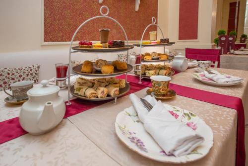 a table with several plates of food on it at Dann Carlton Quito in Quito
