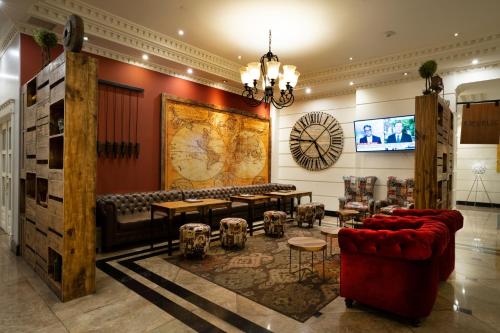 a room with couches and a map on the wall at Dann Carlton Quito in Quito