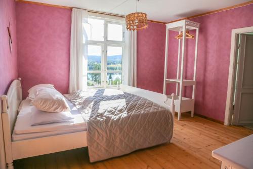Postel nebo postele na pokoji v ubytování Lakeside Guesthouse, Lillstugan