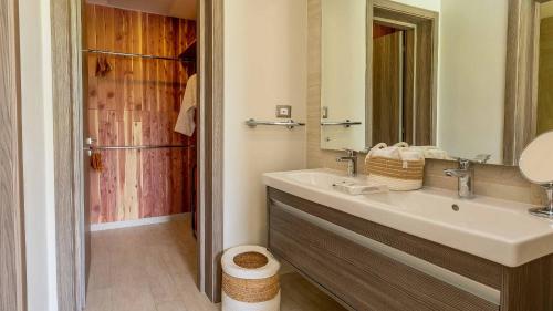 a bathroom with a sink and a shower at Luxury Pool & Golf View Aptin in Hard Rock Golf PC in Punta Cana