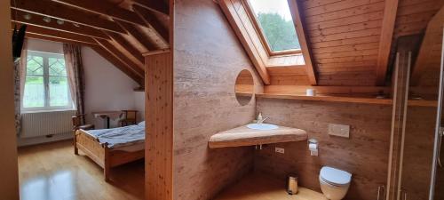 a bedroom with a bed and a sink in a room at Villa Theresa in Hofstetten