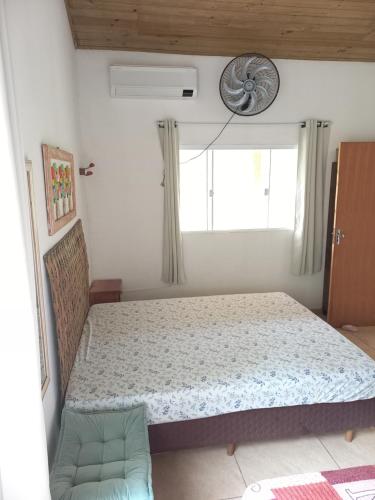 מיטה או מיטות בחדר ב-Recanto dos Lobosco