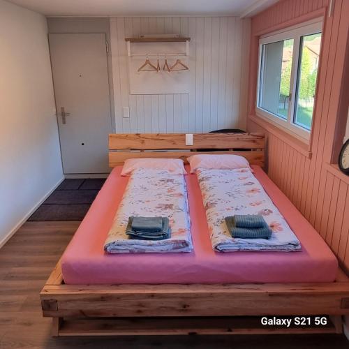 two mattresses on a bed in a room at Mountain - Lake Apartment 3 in Wilderswil