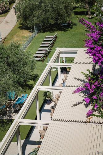 an overhead view of a house with a roof at Hotel Baia Azzurra - Lake Front in Nago-Torbole