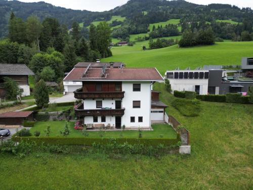 an aerial view of a house in a field at Ferienwohnung Familie Fiechtl in Fügenberg