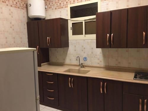 Una cocina o cocineta en بسمات الشرق للشقق المخدومة