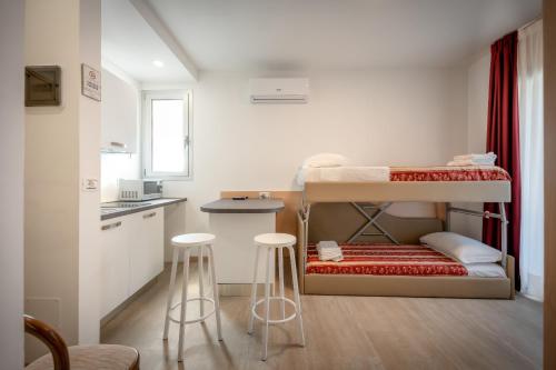 Postel nebo postele na pokoji v ubytování Hotel Palladio