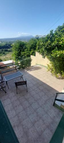 a group of benches sitting on top of a patio at Consoli Crispino in Francolise