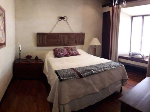 Ліжко або ліжка в номері Casa Antigua