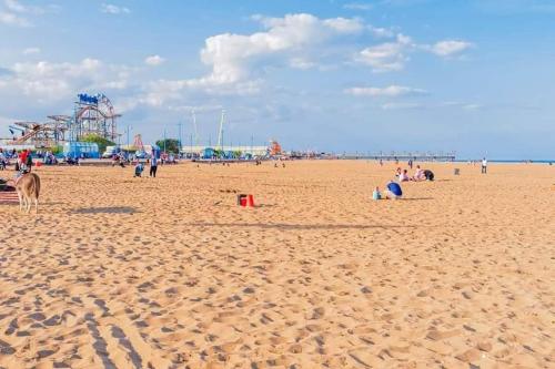 a group of people on a sandy beach at Making Memories Holiday Caravan in Skegness