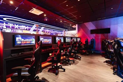 a video game room with chairs and consoles at Making Memories Holiday Caravan in Skegness