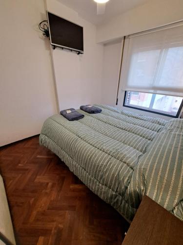 Giường trong phòng chung tại Departamento de Categoria Zona Centro